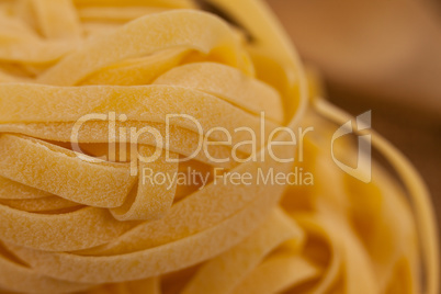 Fettuccine pasta on wooden table