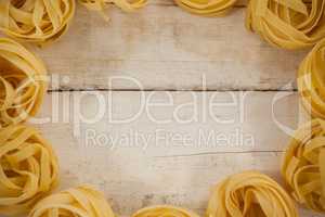 Fettuccine pasta on wooden table