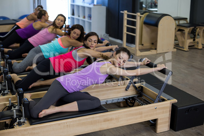 Group of women exercising on reformer