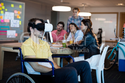 Physically disabled man on wheelchair using VR headset