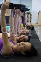 Group of women exercising with pilates ring