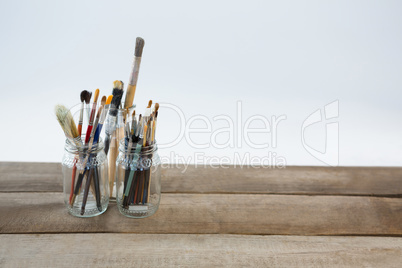 Various paintbrush in glass jar