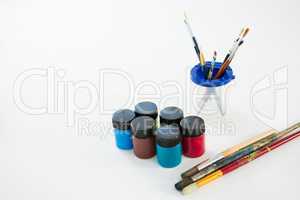 Various paintbrush and watercolors on white background