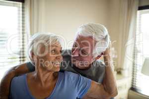 Senior couple romancing in bedroom