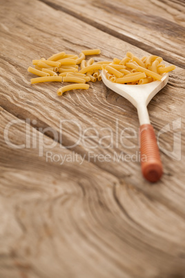 Spoon filled with macaroni pasta