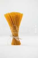 Bundle of raw spaghetti tied with rope