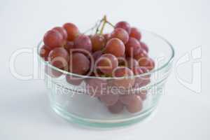 Close-up of red bunch of grapes in glass bowl