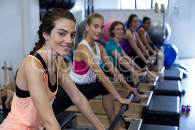 Group of women exercising on reformer