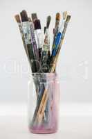 Various paintbrush in a jar