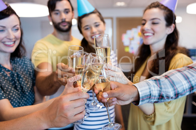 Creative business team having a toast on colleges birthday Creative business team having a toast on