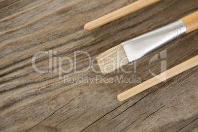 Paintbrushes on wooden surface