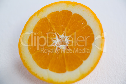 Ripe tasty orange cut into halves