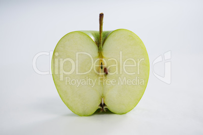 Close-up of halved green apple