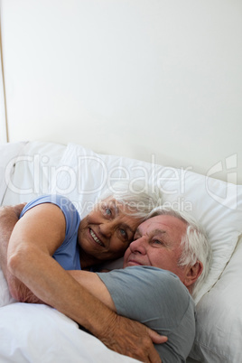 Senior couple embracing each other in the bedroom