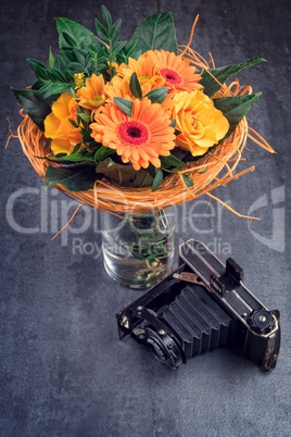 bouquet and old camera