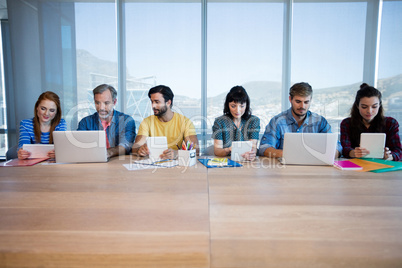 Creative business team sitting in a row and working together