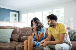 Couple arguing with each other in living room