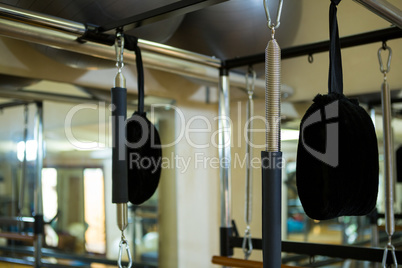 Close-up of reformer on wooden floor