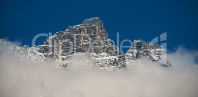 View of snowy mountain range and clouds