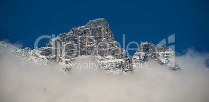 View of snowy mountain range and clouds