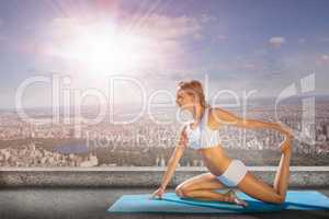 Composite image of gorgeous fit blonde in seated yoga pose
