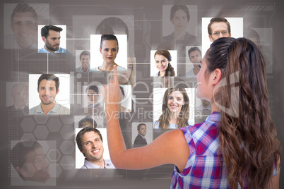 Composite image of pretty brunette pointing something with her finger