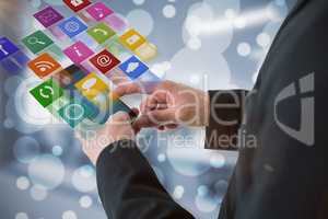 Composite image of businessman using smart phone 3d