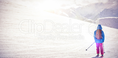 Skier skiing on snow covered mountains