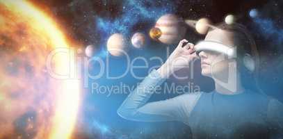 Composite image of woman experiencing virtual reality headset 3d
