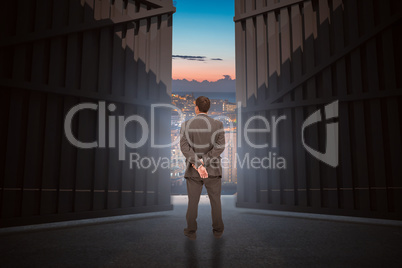 Composite image of rear view of classy businessman posing 3d