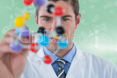 Composite image of young scientist experimenting molecule structure 3d
