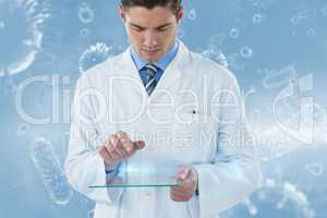 Composite image of male doctor using futuristic glass 3d