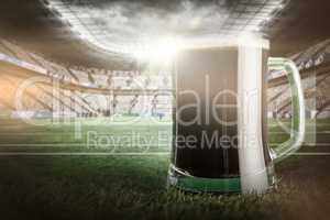 Composite image of green beer mug on grass for st patricks day 3d