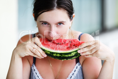 Woman eating watermelon