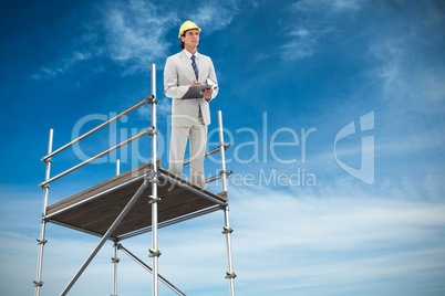 Composite image of architect taking notes 3d