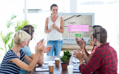 Composite image of colleagues clapping hands in a meeting