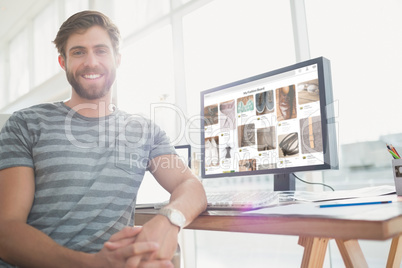 Composite image of  portrait of a casual businessman posing and smiling