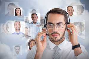 Composite image of portrait of a focused businessman with headphone