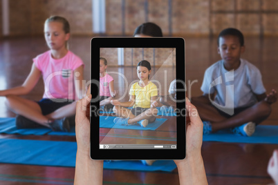 Composite image of close-up of hands holding digital tablet