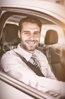 Businessman sitting in drivers seat