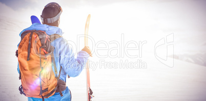 Skier looking at beautiful snow-covered mountains