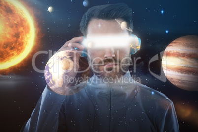 Composite image of young male using virtual reality headset 3d