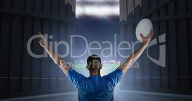 Composite image of rear view of rugby player holding ball with arms raised 3d