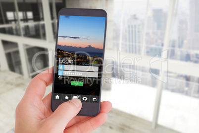 Composite image of female hand holding a smartphone