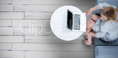 Composite image of woman on her laptop