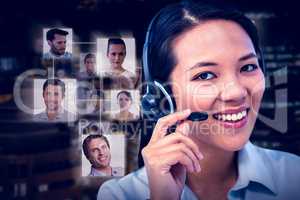 Composite image of smiling businesswoman using headset