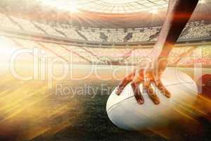Composite image of composite image of cropped image of athlete holding rugby ball 3d