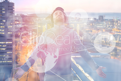 Composite image of man with arms outstretched while listening music 3d