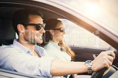 couple in a car smiling