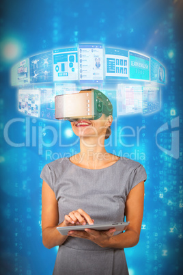 Composite image of woman holding digital tablet and using virtual reality headset 3d